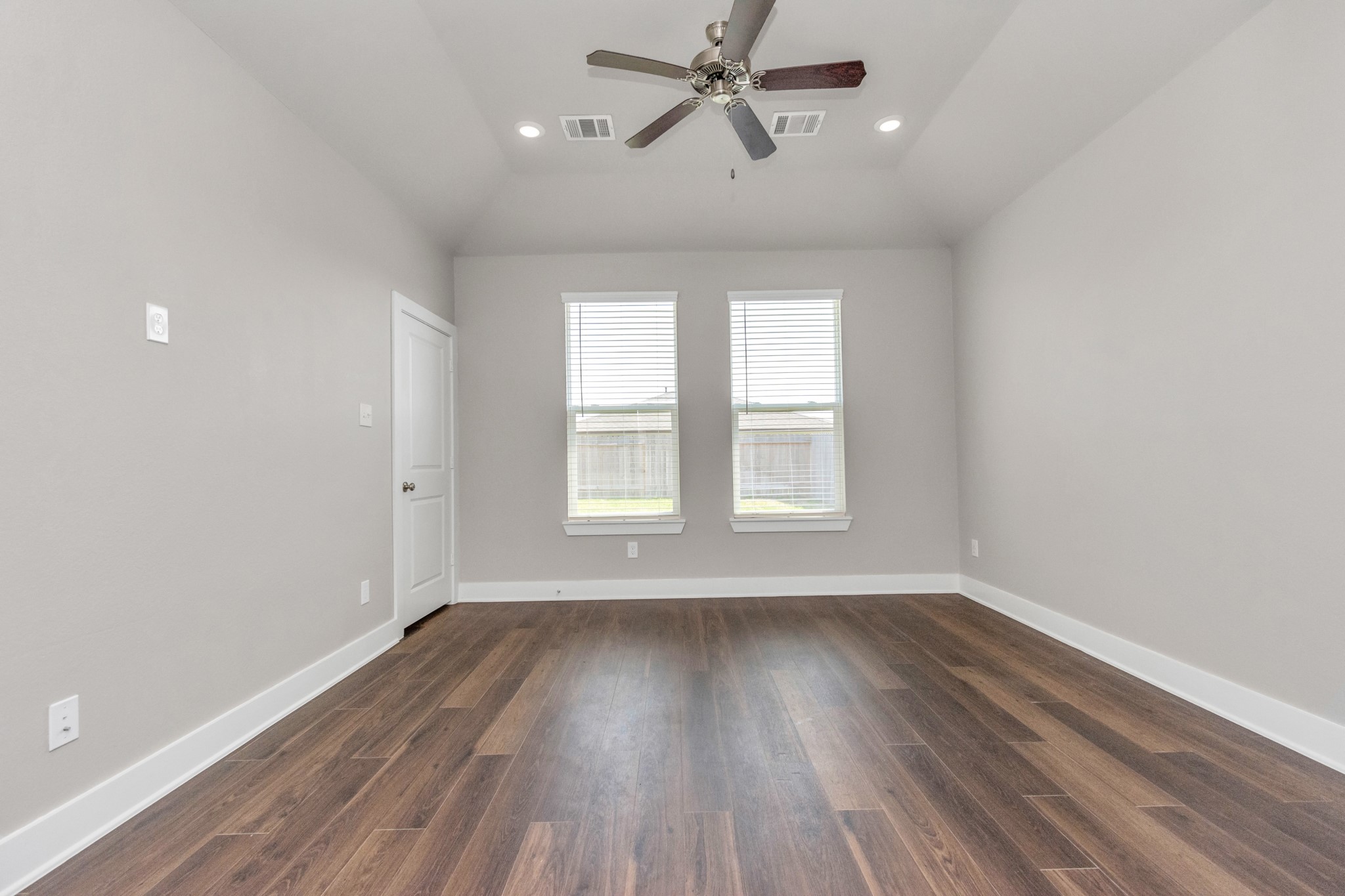 10526 Moon Valley Lane Rosharon, TX 77583 - Photo 9 of 24 Large Primary Bedroom offers wonderful wood floors and ceiling fan. Great clean look!