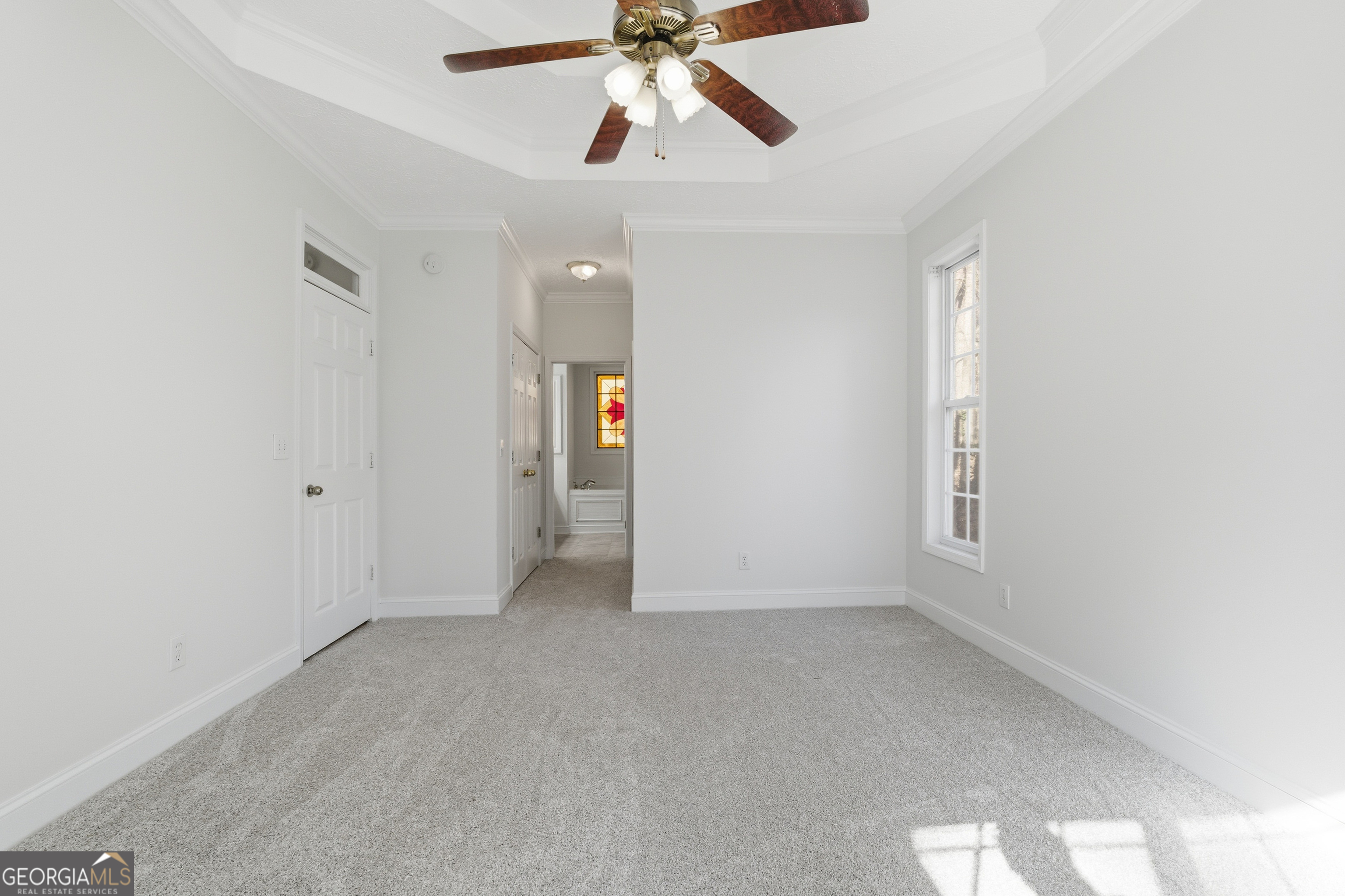 1217 Monticello Drive Villa Rica, GA 30180 - Photo 12 of 36 an empty room with chandelier fan
