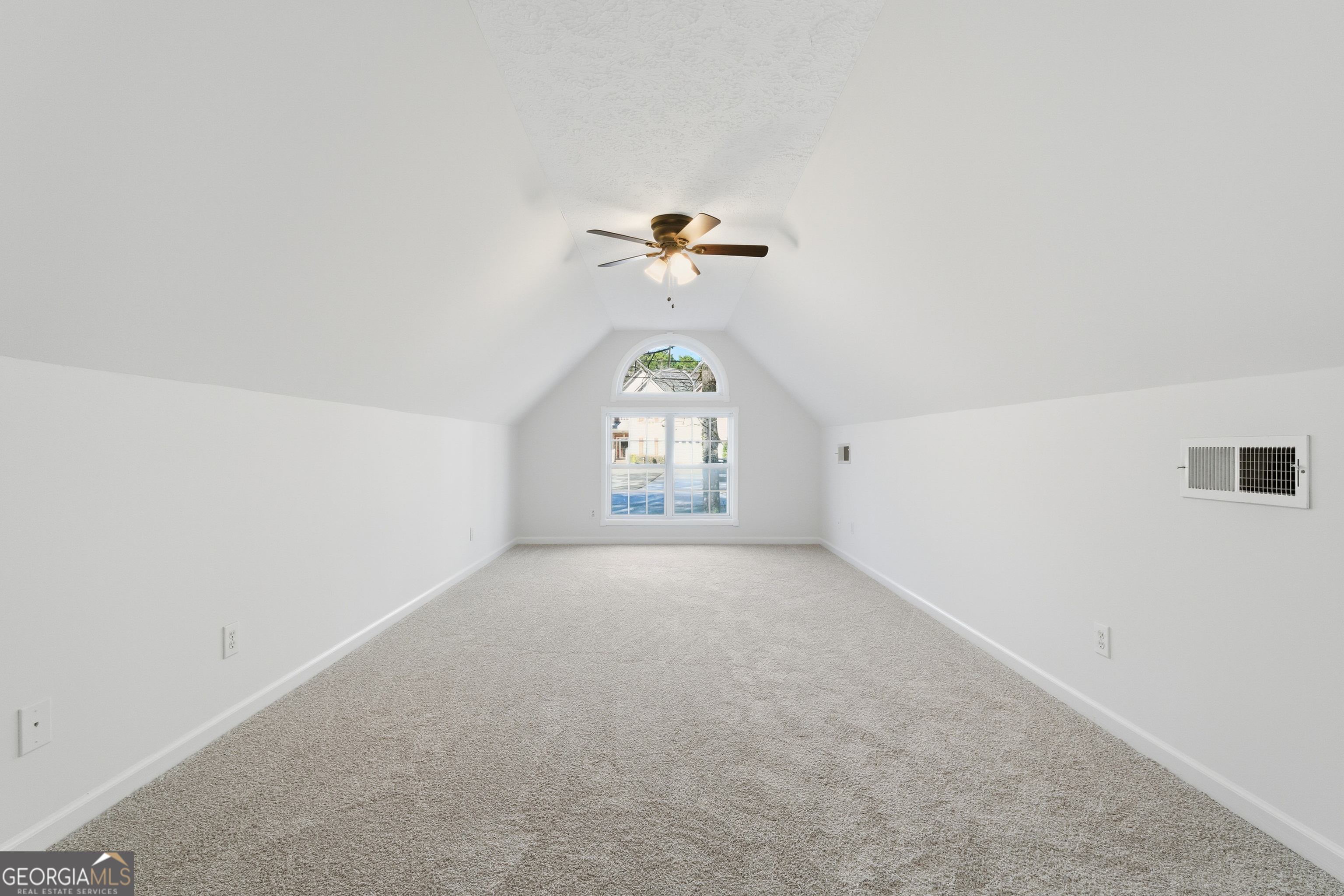 1217 Monticello Drive Villa Rica, GA 30180 - Photo 20 of 36 an empty room with a window and ceiling fan