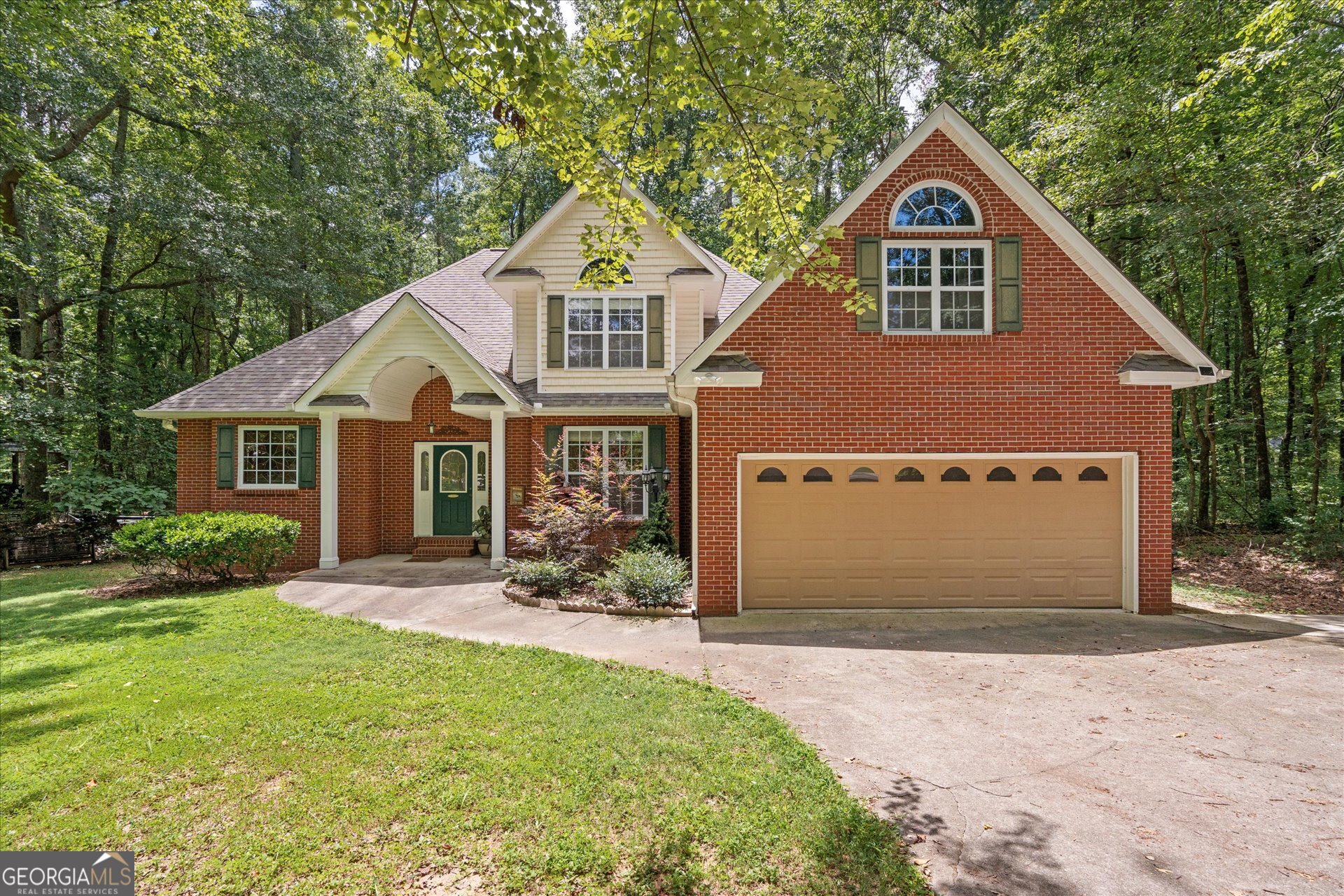 1217 Monticello Drive Villa Rica, GA 30180 - Photo 35 of 36 a front view of a house with yard
