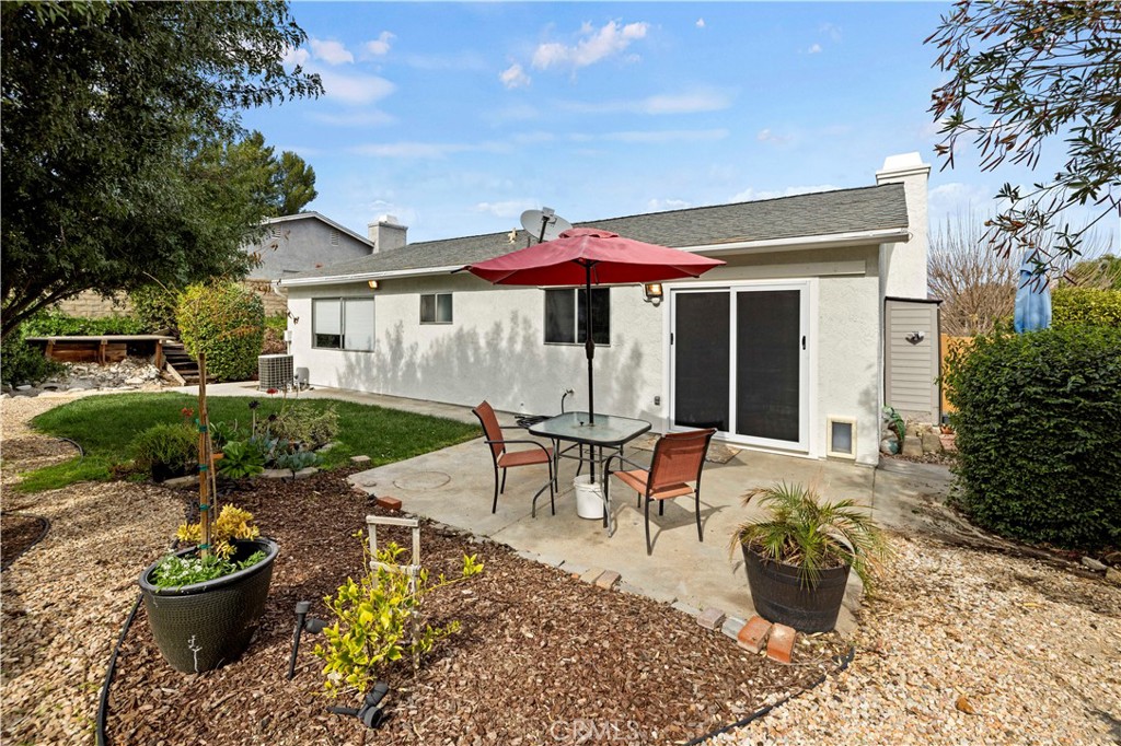 28014 Fox Run Circle Castaic, CA 91384 - Photo 19 of 27 a view of a house with backyard sitting area and swimming pool