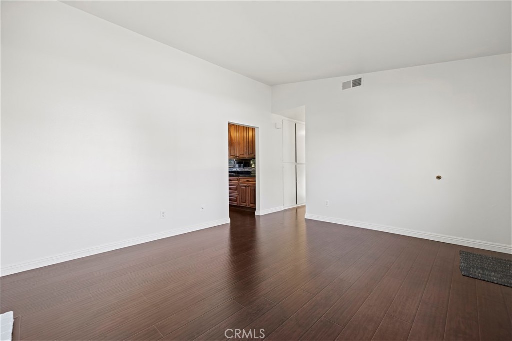 28014 Fox Run Circle Castaic, CA 91384 - Photo 4 of 27 a view of an empty room with wooden floor and a window