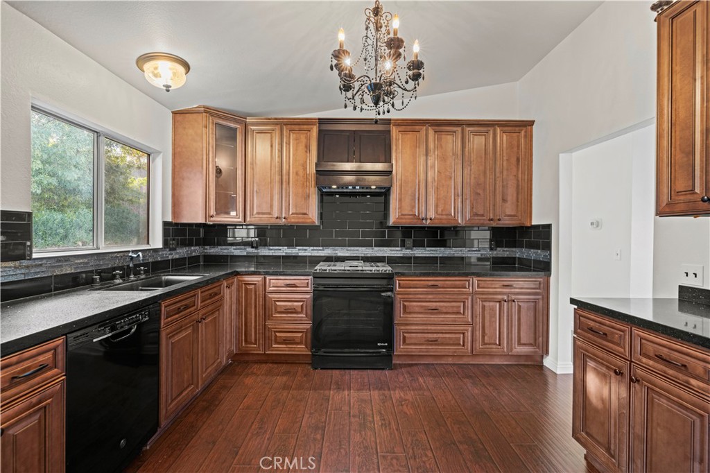 28014 Fox Run Circle Castaic, CA 91384 - Photo 5 of 27 a large kitchen with stainless steel appliances granite countertop a stove and a sink