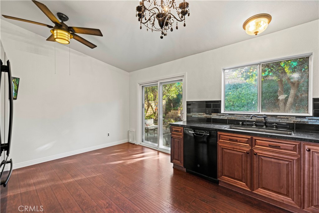 28014 Fox Run Circle Castaic, CA 91384 - Photo 9 of 27 a kitchen with stainless steel appliances a stove cabinets and wooden floor