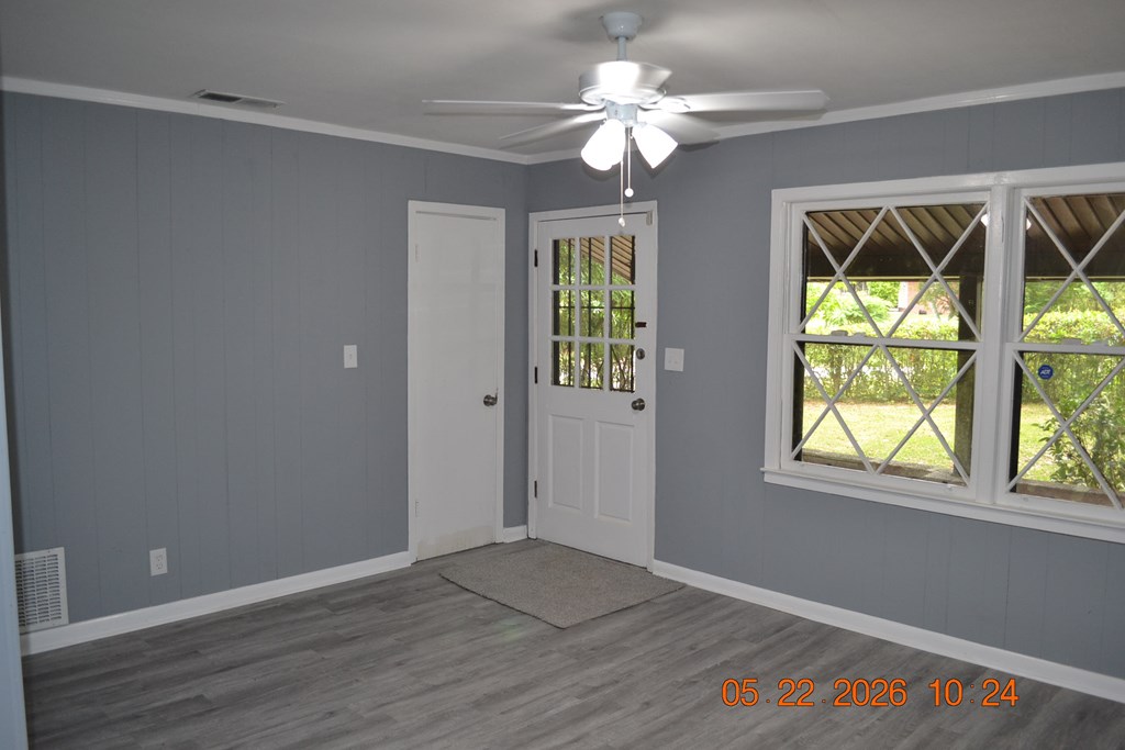 5552 Valleybrook Road Columbus, GA 31907 - Photo 3 of 27 wooden floor in an empty room with a window