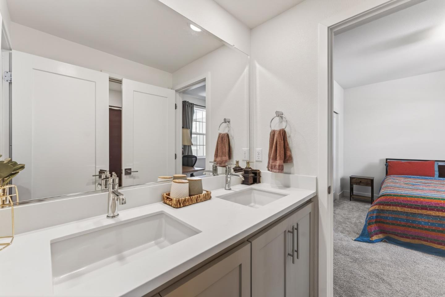9532 Seawind Way Newark, CA 94560 - Photo 19 of 44 a bathroom with double vanity sink and a mirror