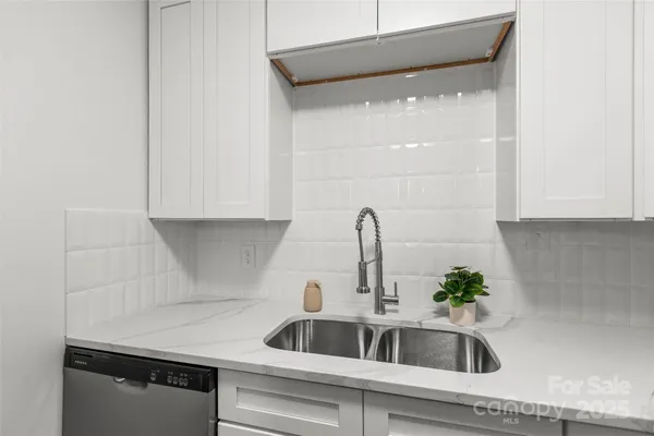 a kitchen with a sink and cabinets