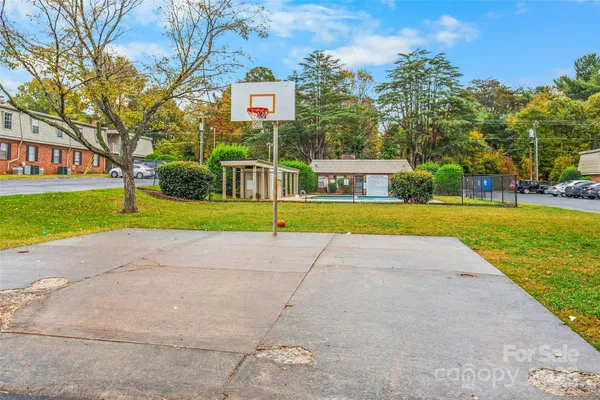 a view of a street with a house in the background