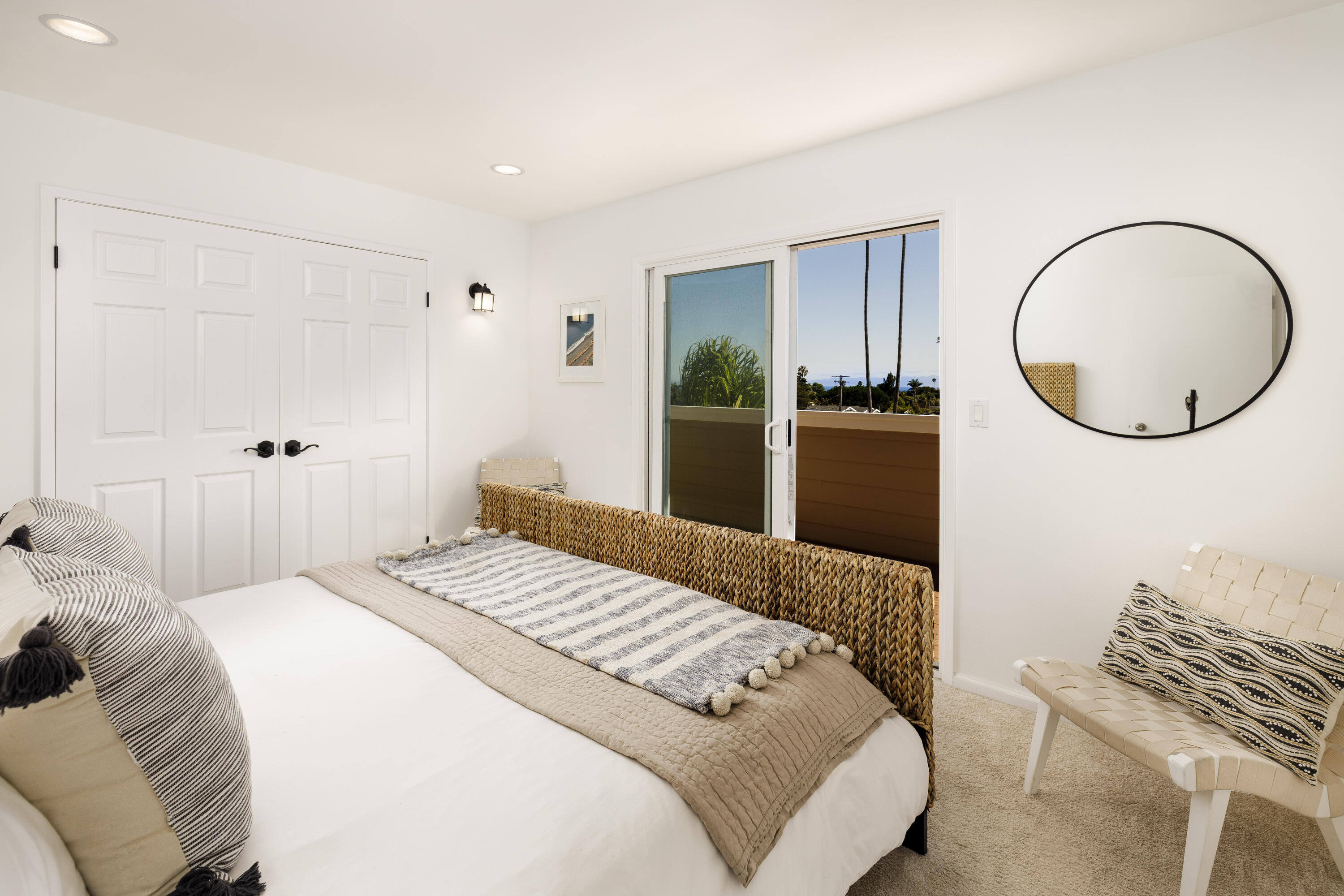425 Fellowship Road Santa Barbara, CA 93109 - Photo 10 of 20 a bedroom with a bed mirror and a window