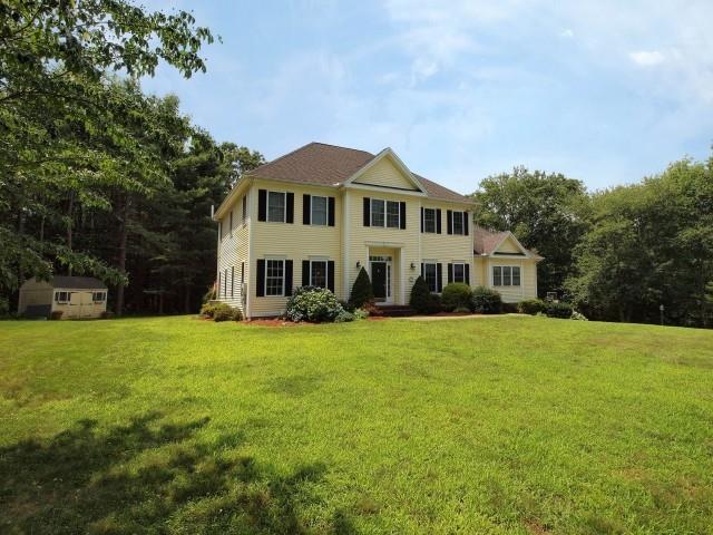 52 Pine Tree Hill Road Newtown, CT 06470 - Photo 1 of 1 a front view of a house with a garden