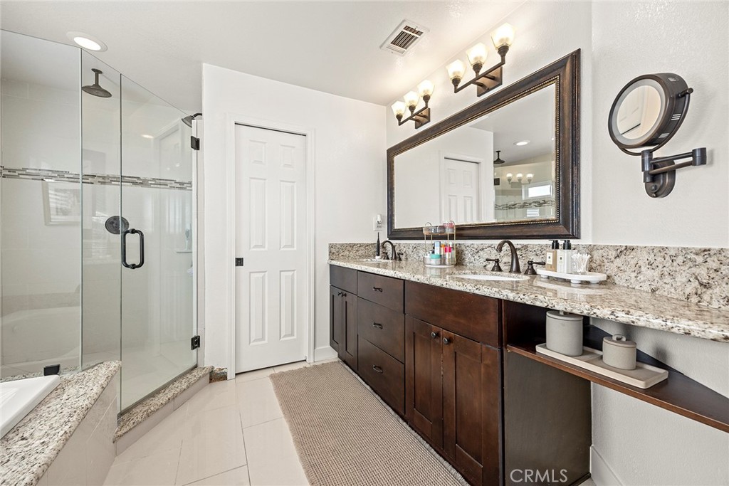 15914 West Road Whittier, CA 90603 - Photo 27 of 47 a spacious bathroom with a double vanity sink mirror double and shower