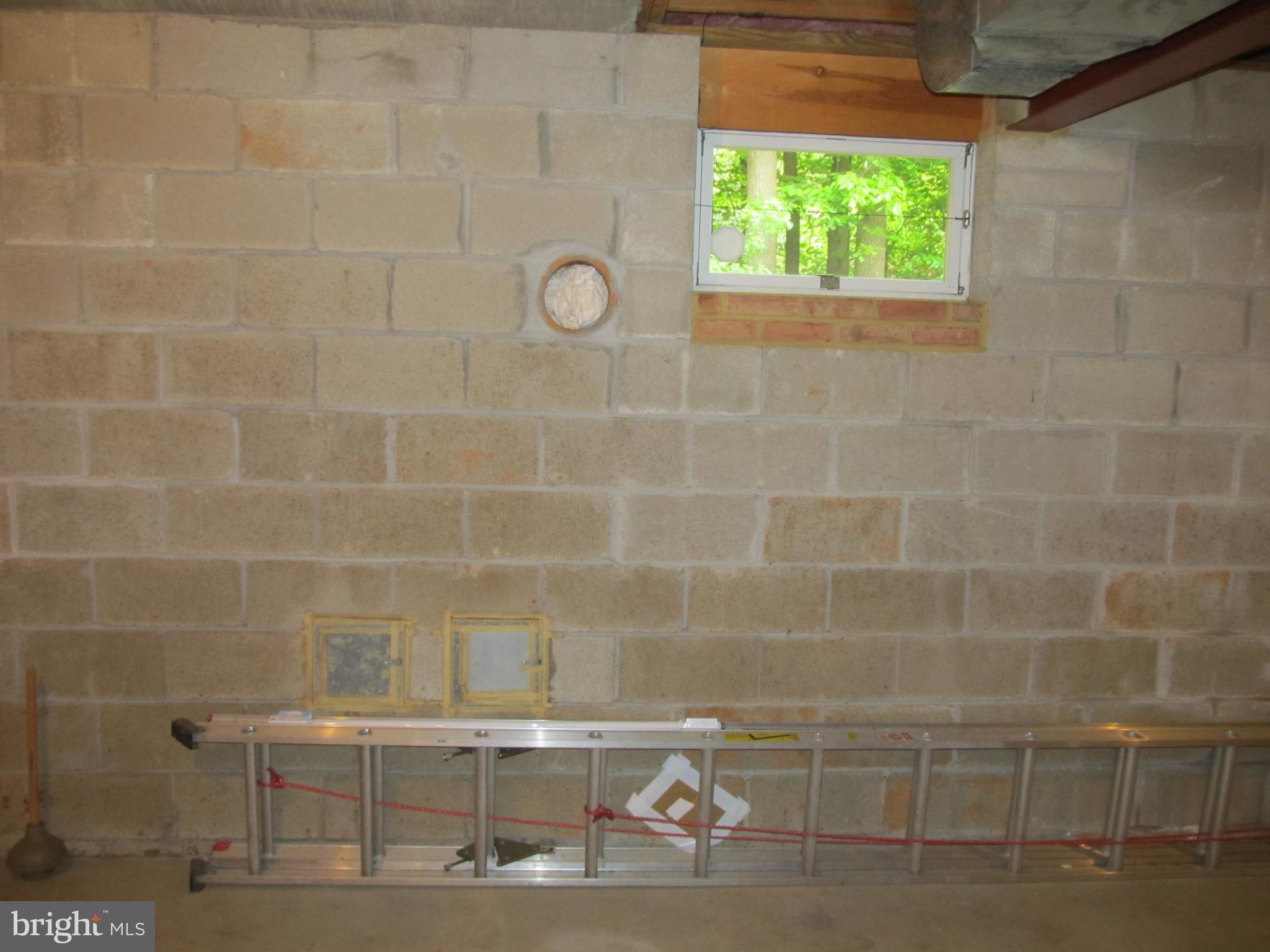 5 Ridgecliff Court Kingsville, MD 21087 - Photo 39 of 43 Basement wall shows rough in for woodstove.
