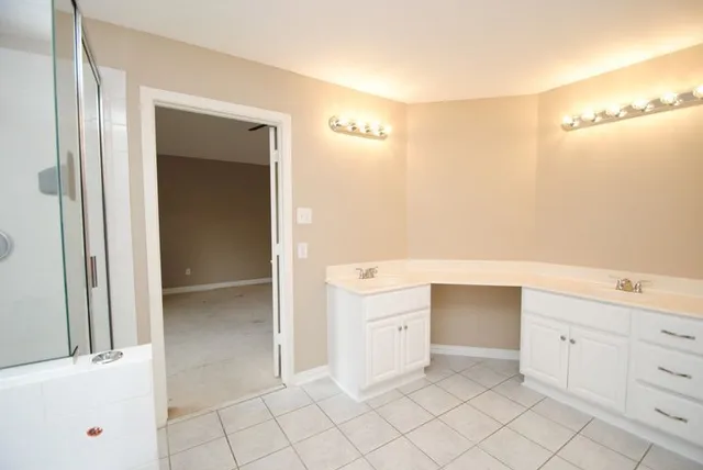 a room with a mirror and a sink