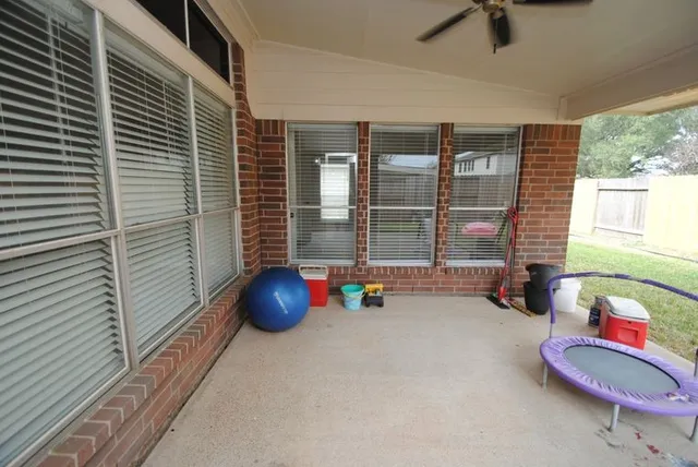 a room with a toys and two windows