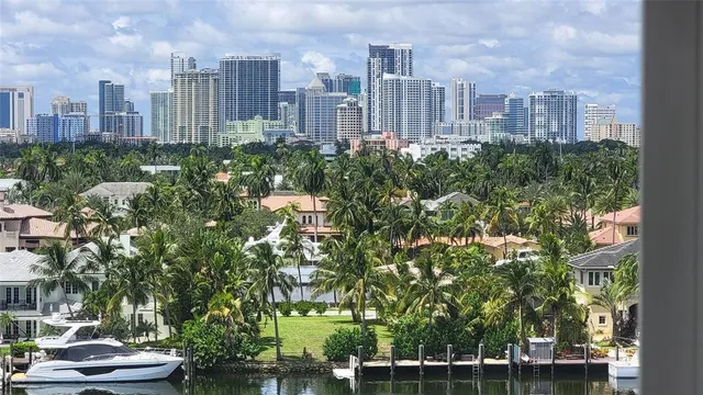 a view of a livingroom with furniture and a flat screen tv