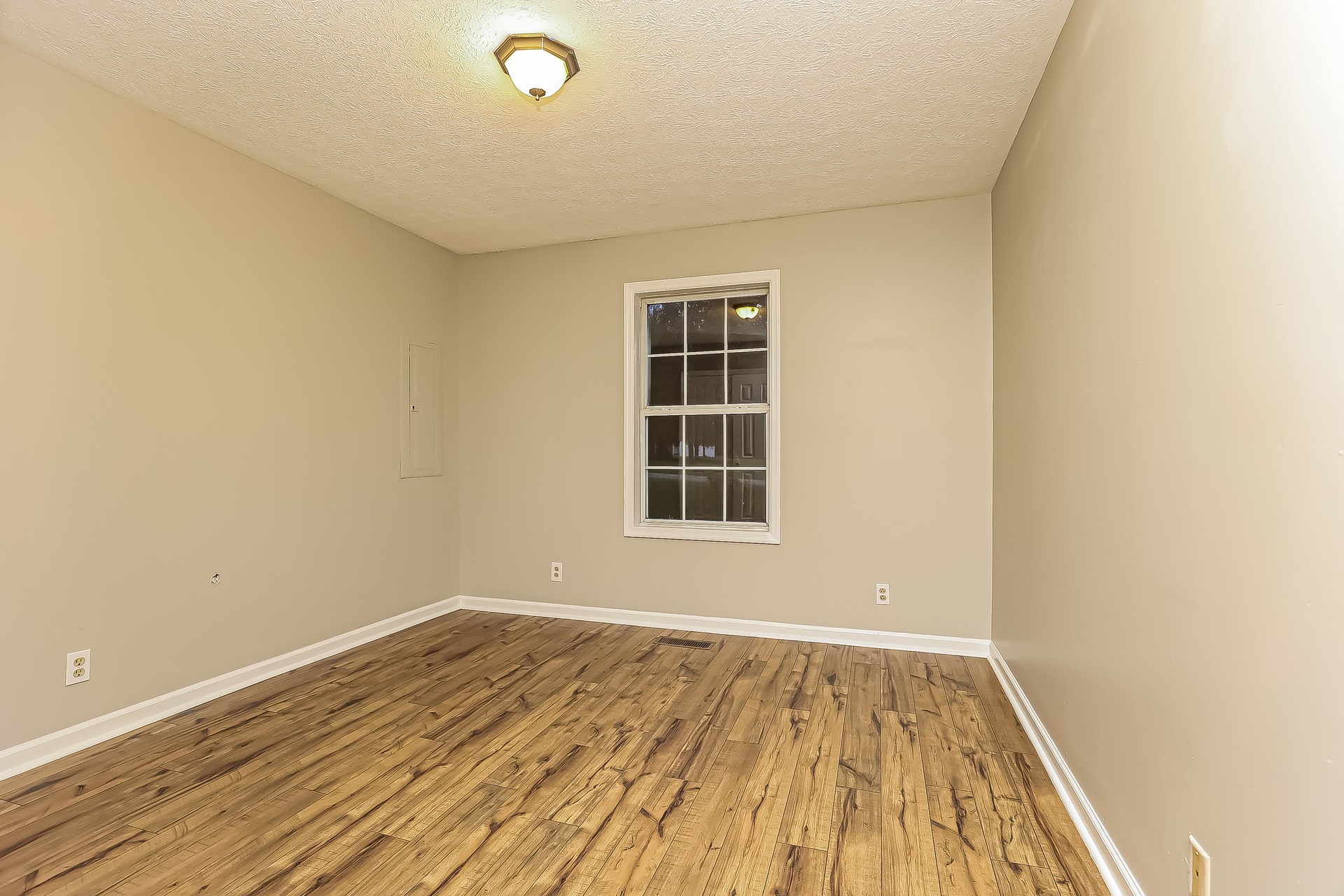 285 Tom Ferrell Road Portland, TN 37148 - Photo 14 of 25 an empty room with wooden floor and windows