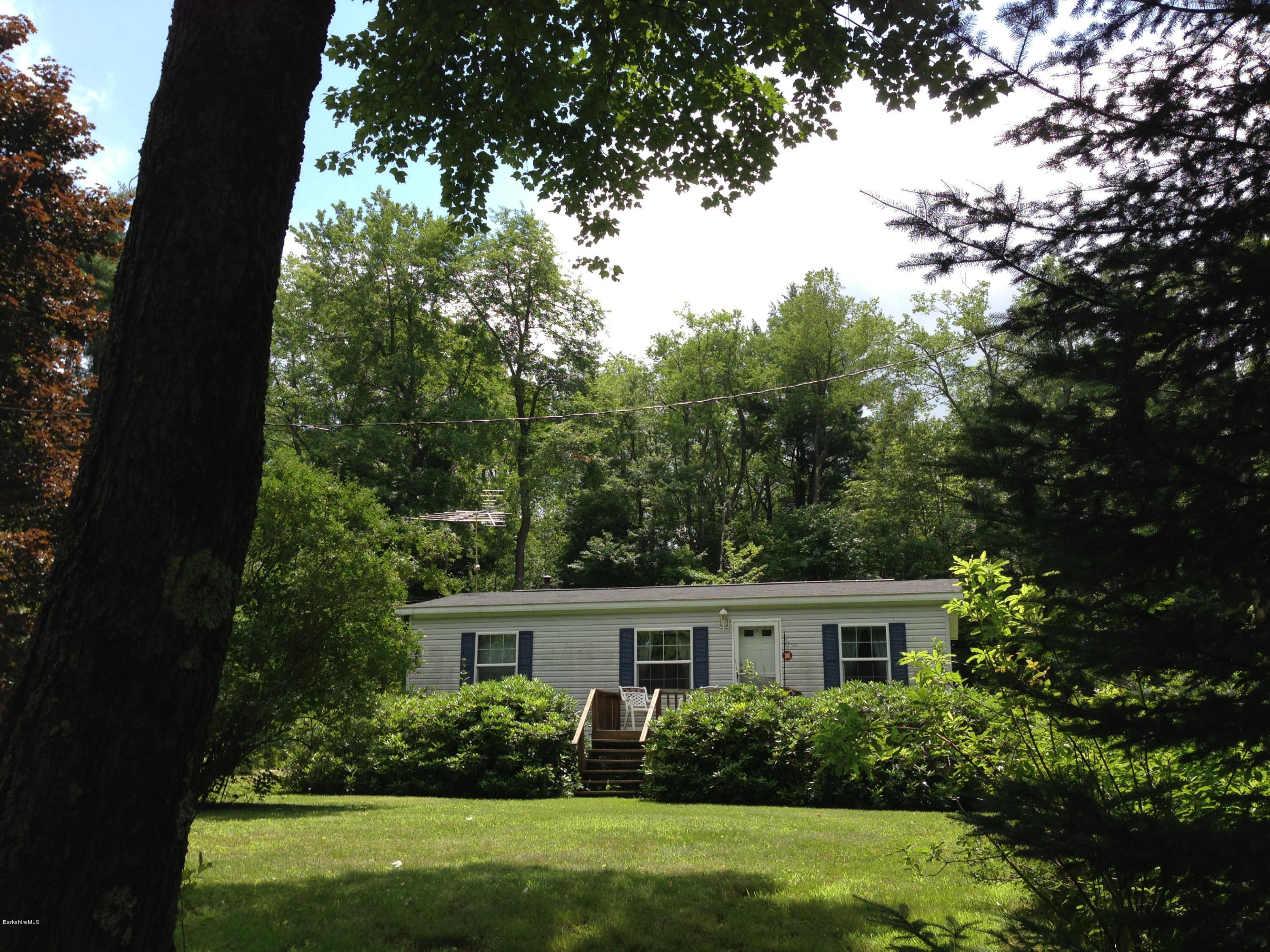 576 East Otis Road Otis, MA 01253 - Photo 2 of 13 front view of house with a yard