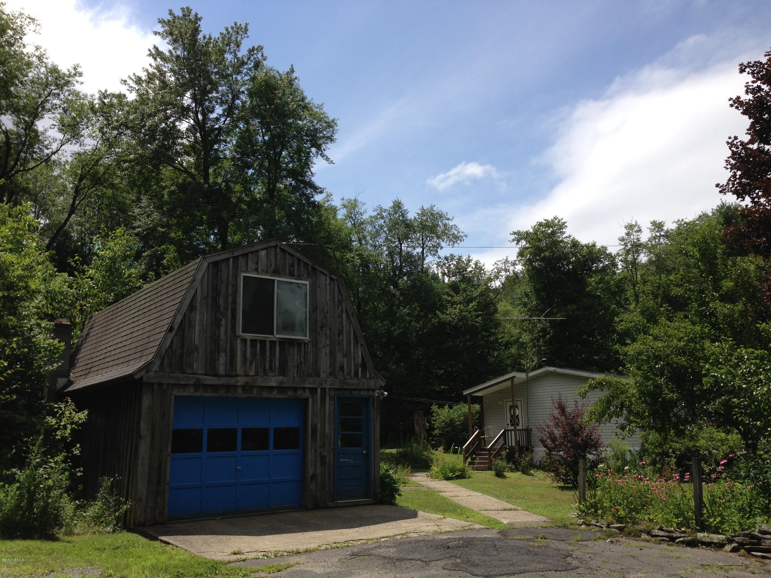 576 East Otis Road Otis, MA 01253 - Photo 3 of 13 a front view of a house with garden