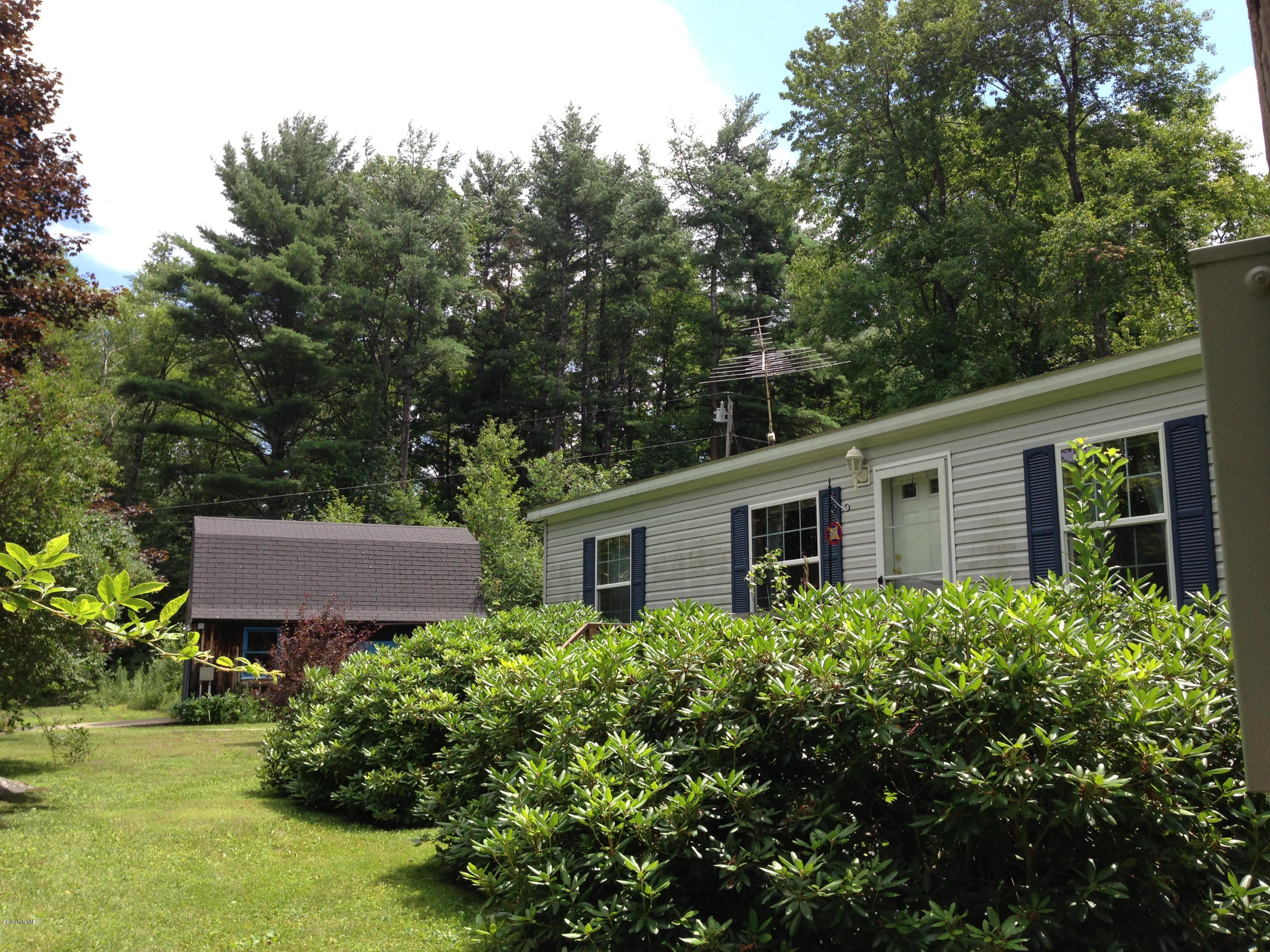 576 East Otis Road Otis, MA 01253 - Photo 5 of 13 front view of a house with a yard