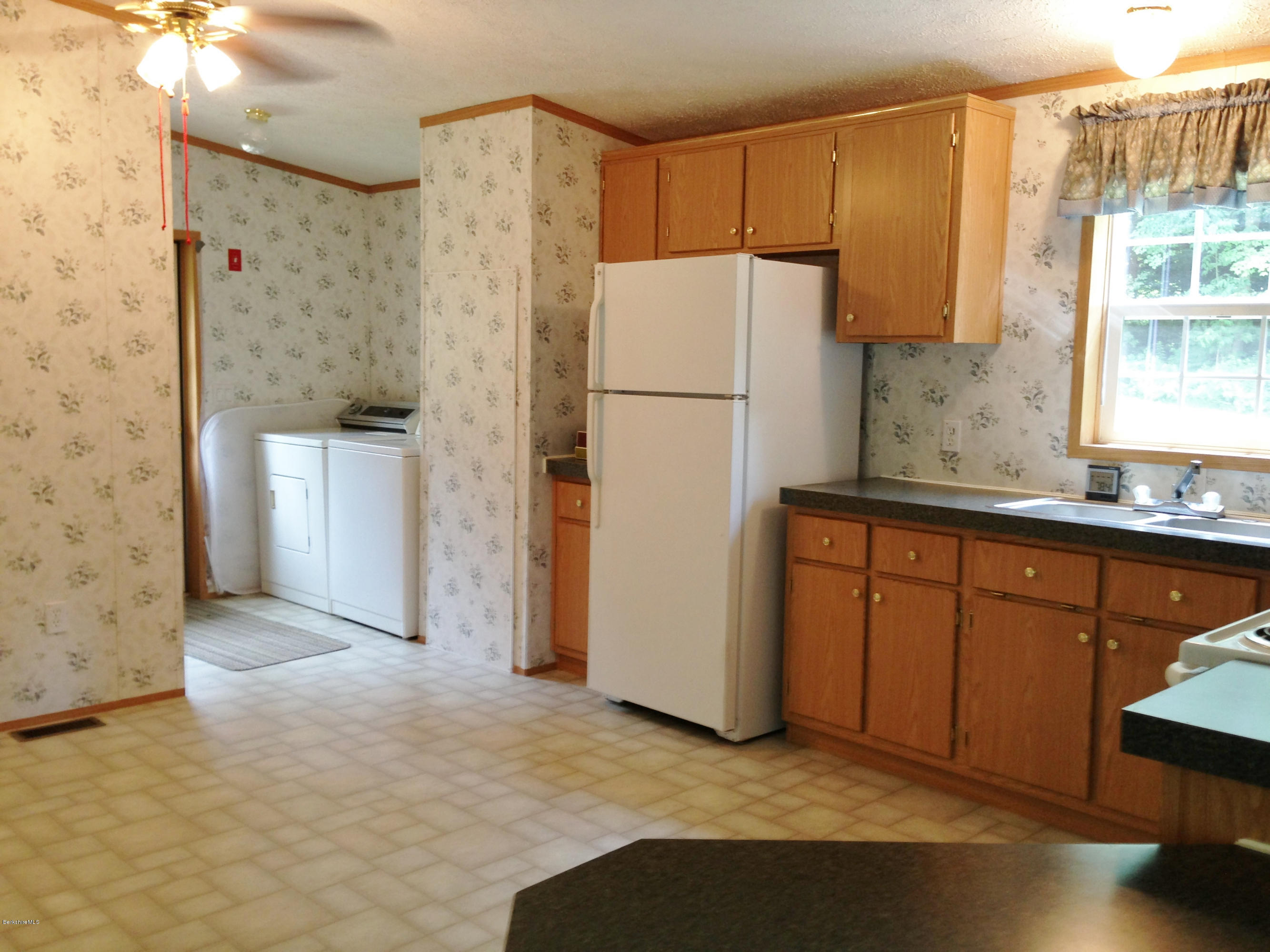 576 East Otis Road Otis, MA 01253 - Photo 9 of 13 a kitchen with stainless steel appliances granite countertop a refrigerator a sink and a stove