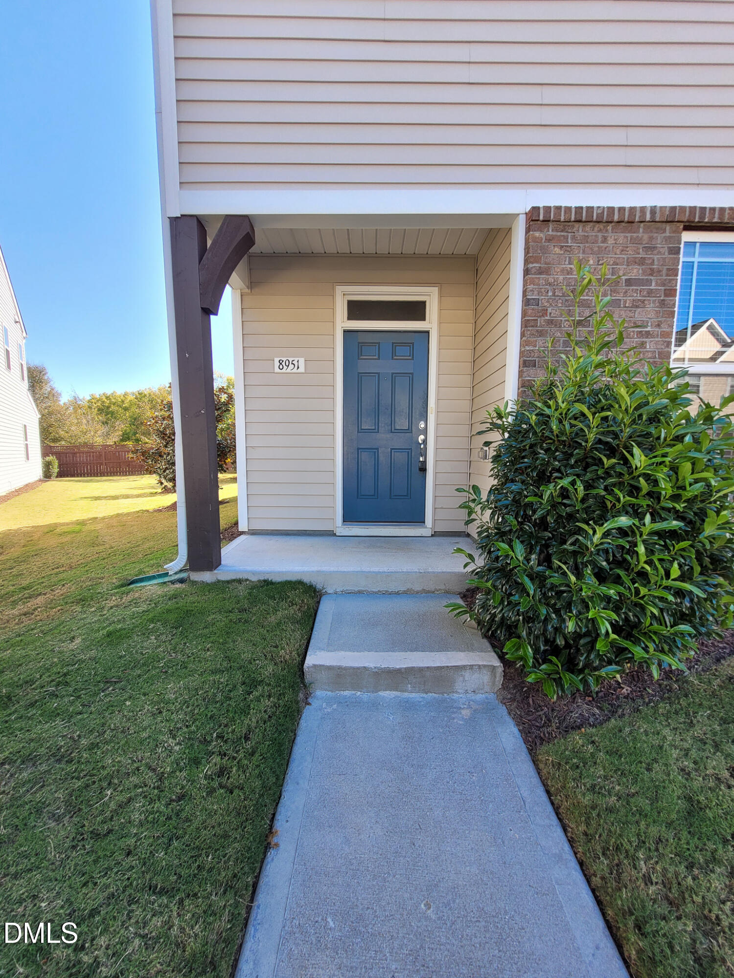 8951 Commons Townes Drive Raleigh, NC 27616 - Photo 2 of 40 a front view of a house with a yard and garage