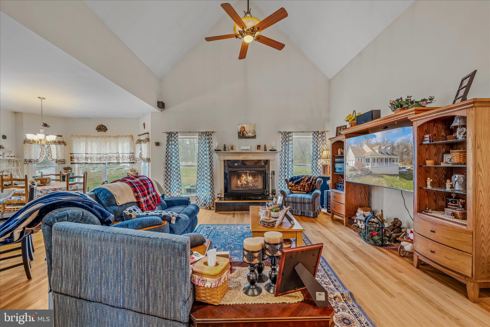 7020 Debold Road Thurmont, MD 21788 - Photo 23 of 83 a living room with furniture a fireplace and a chandelier