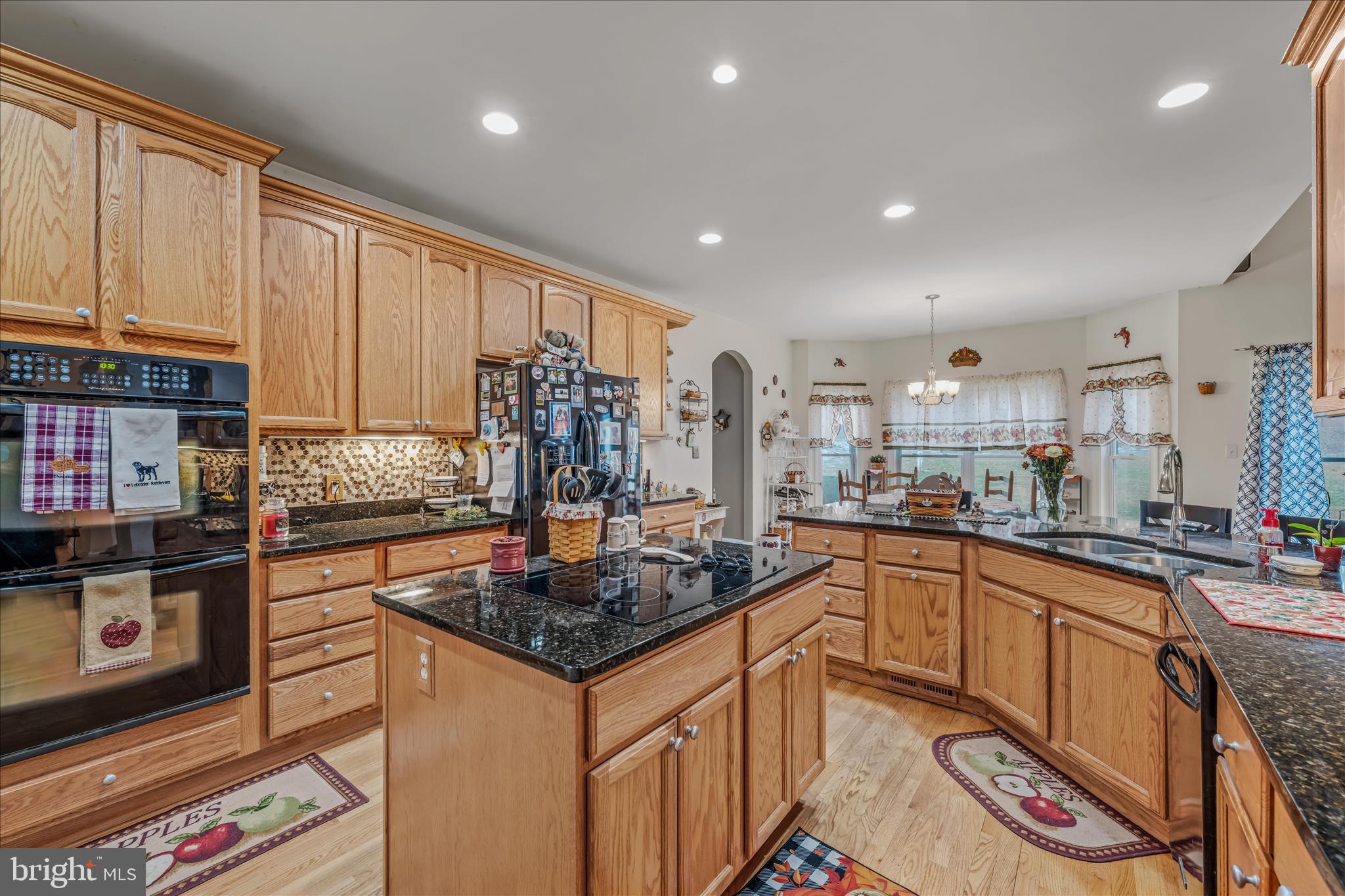 7020 Debold Road Thurmont, MD 21788 - Photo 30 of 83 a kitchen with granite countertop a sink stove and cabinets