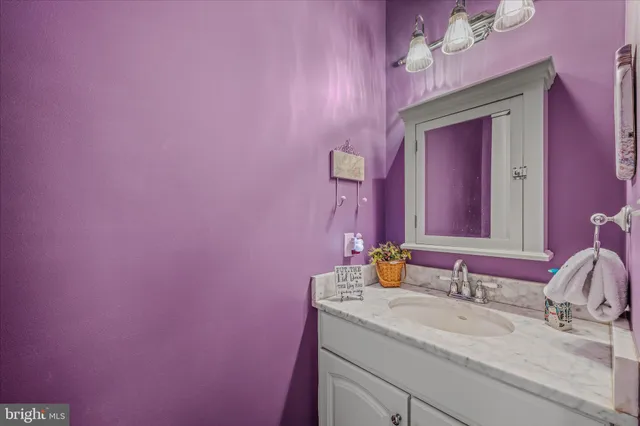 a view of walk in closet with clothes