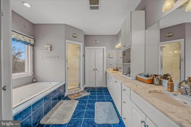 a bedroom with a bed and a desk