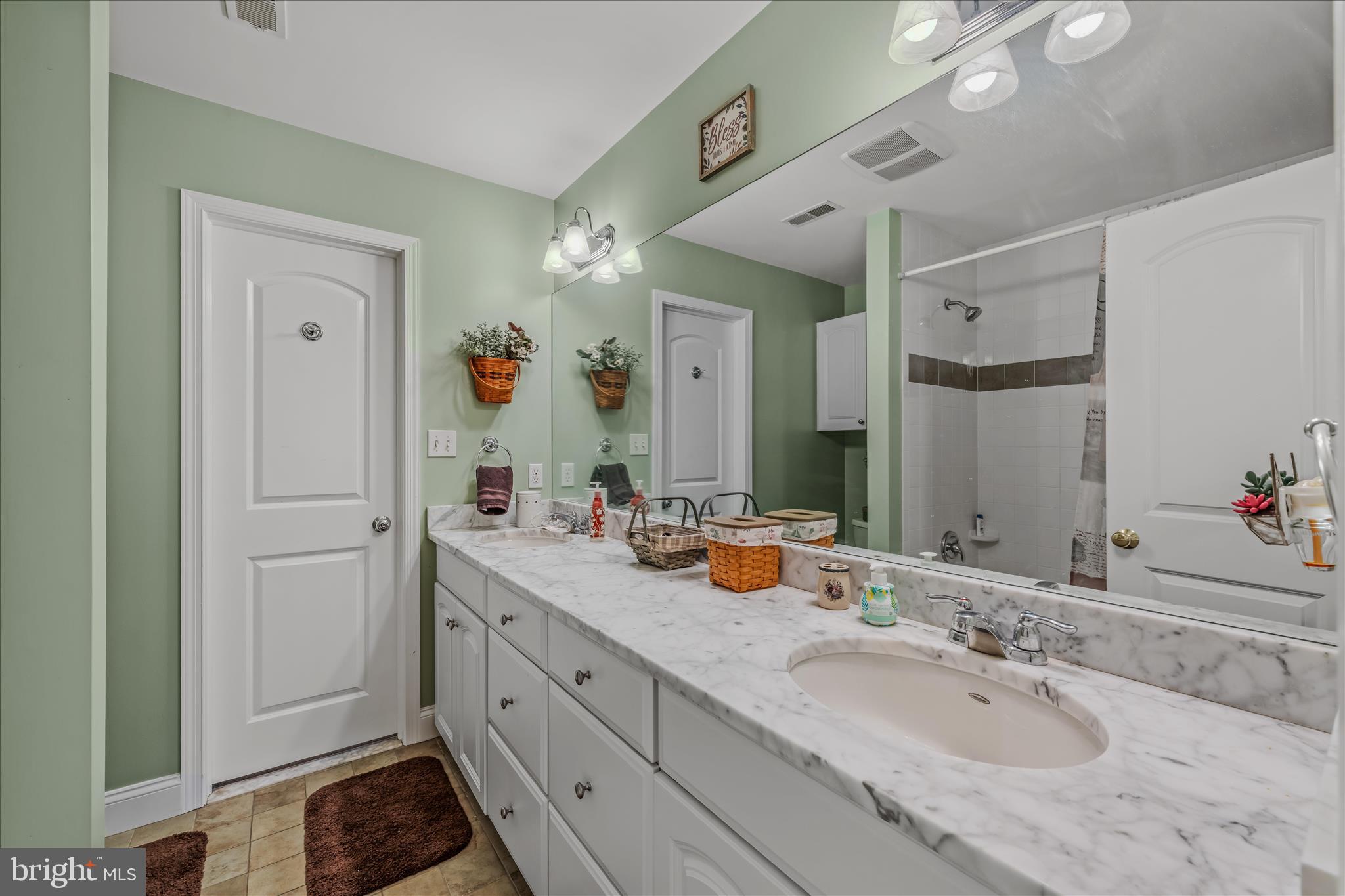 7020 Debold Road Thurmont, MD 21788 - Photo 47 of 83 a spacious bathroom with a granite countertop sink and a mirror