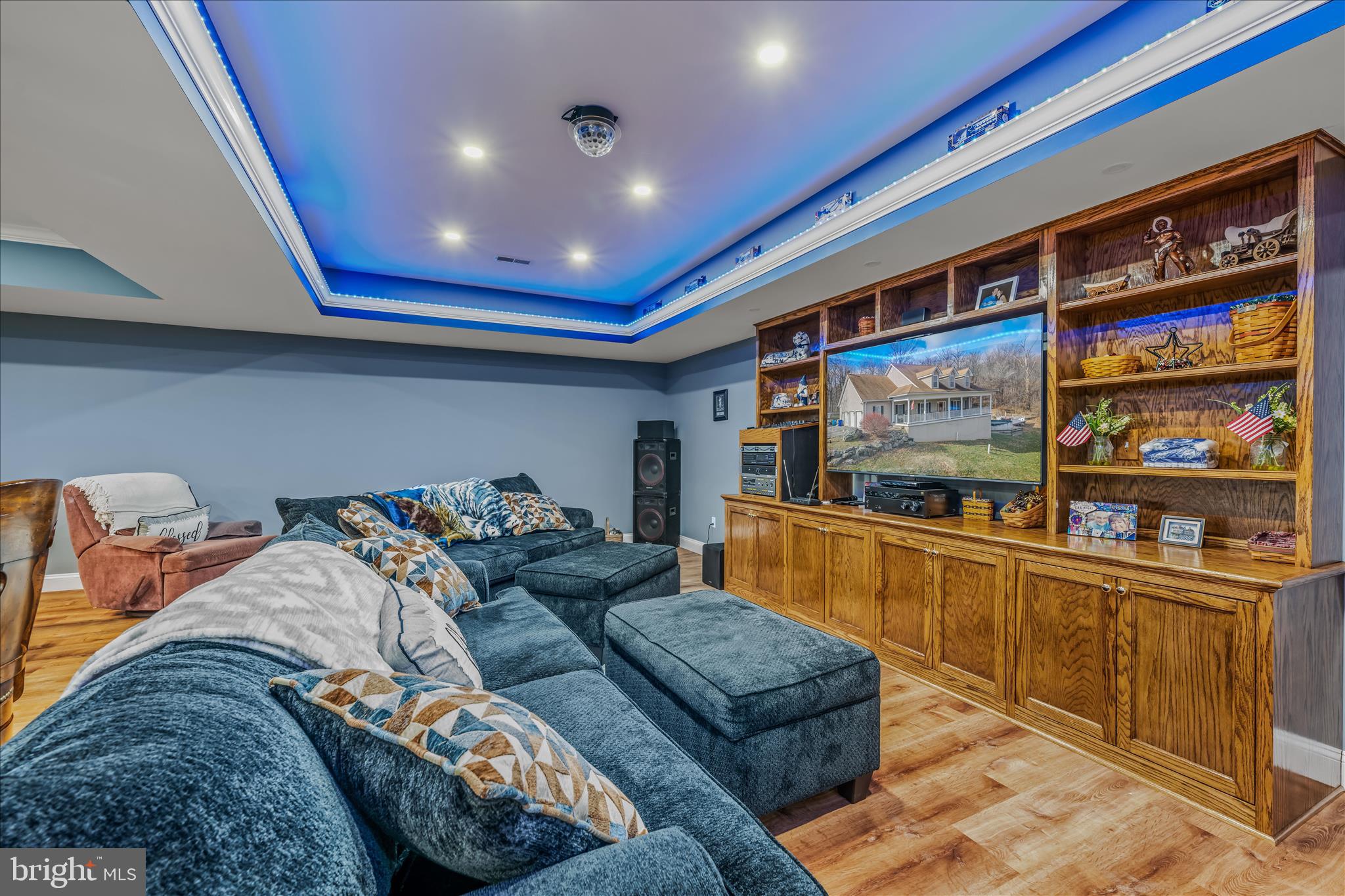 7020 Debold Road Thurmont, MD 21788 - Photo 59 of 83 a living room with furniture a flat screen tv and a floor to ceiling window