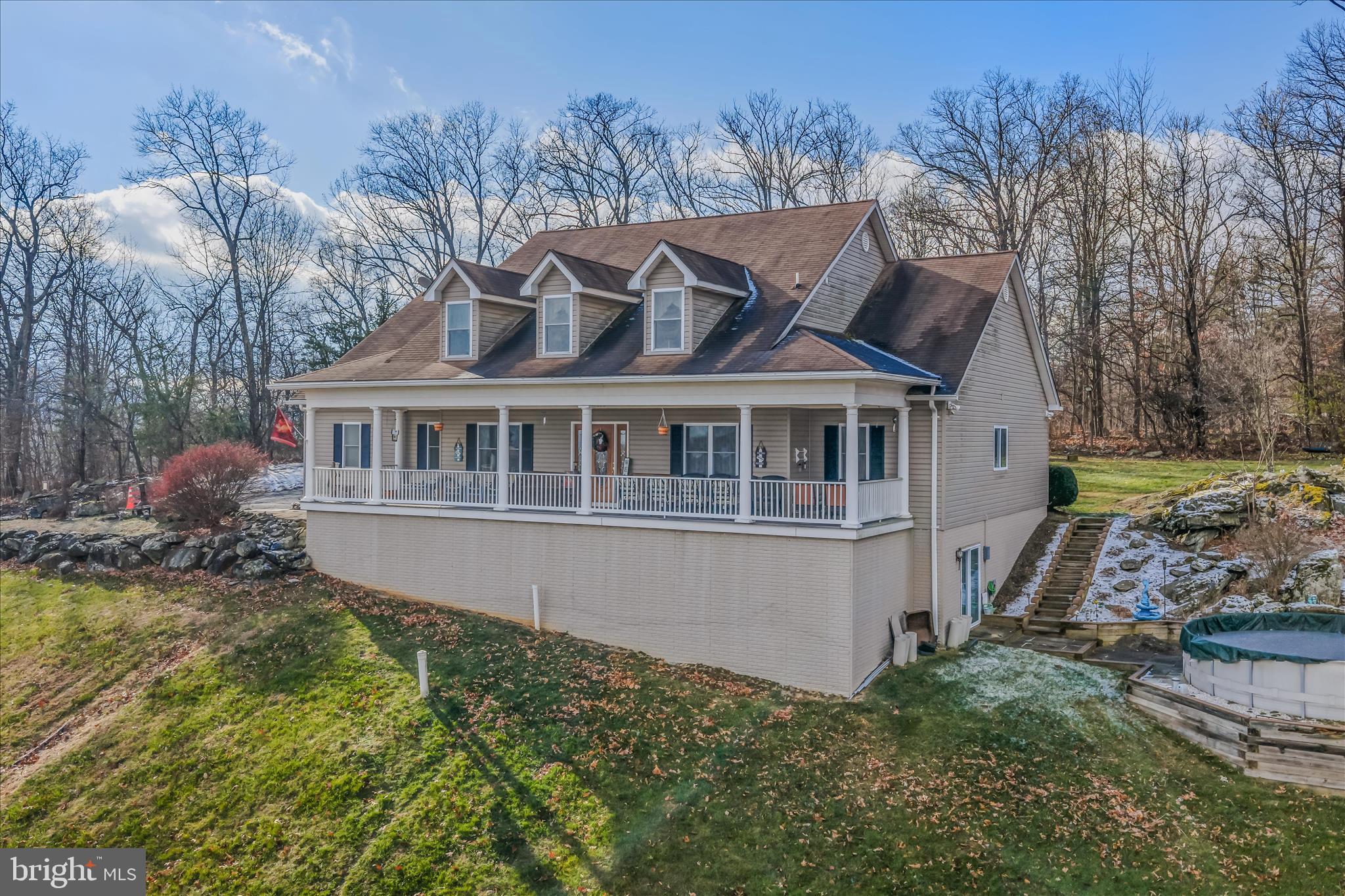 7020 Debold Road Thurmont, MD 21788 - Photo 7 of 83 a aerial view of a house with a yard table and chairs