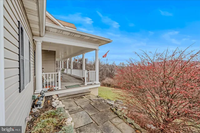 a view of a balcony with wooden floor