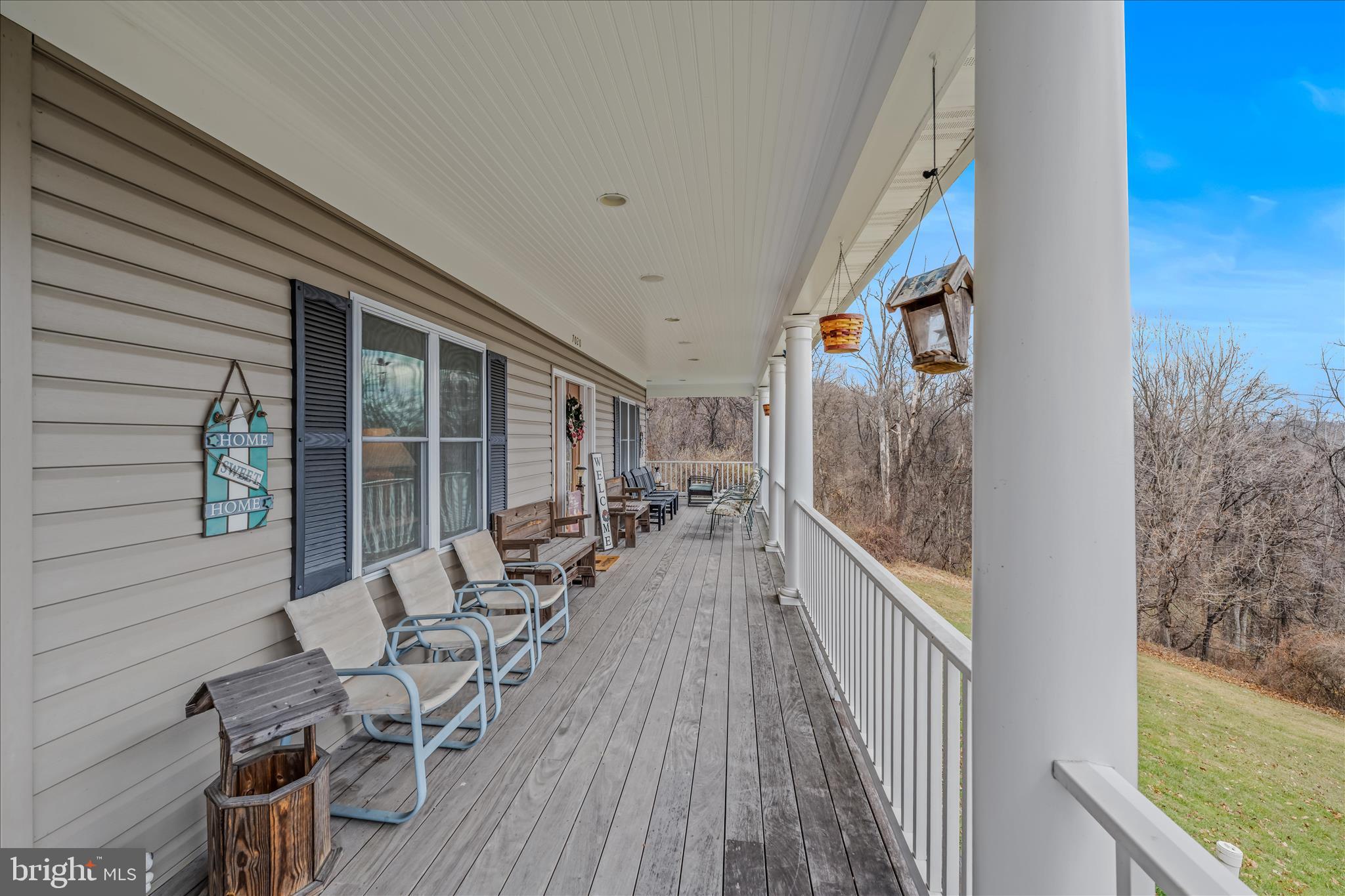 7020 Debold Road Thurmont, MD 21788 - Photo 10 of 83 a view of balcony with chairs and wooden fence