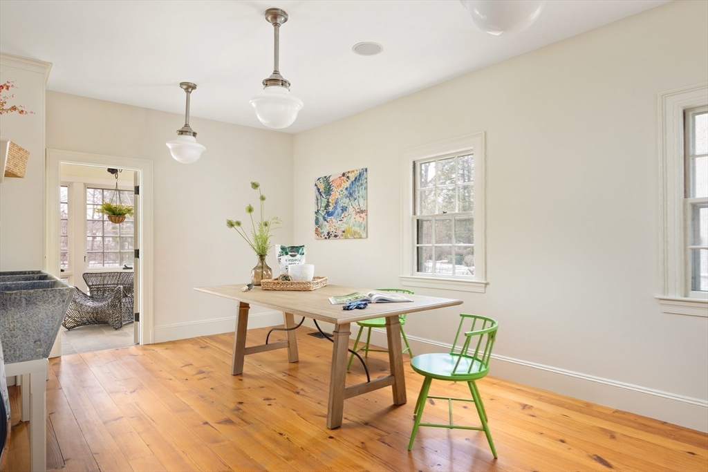 15 Hubbard Park Road Cambridge, MA 02138 - Photo 11 of 31 a view of a dining room with furniture wooden floor and a chandelier