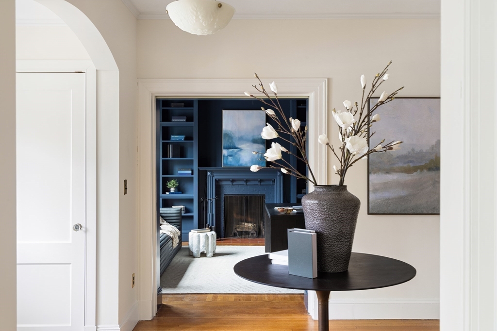 15 Hubbard Park Road Cambridge, MA 02138 - Photo 13 of 31 a dining room with furniture and a fireplace