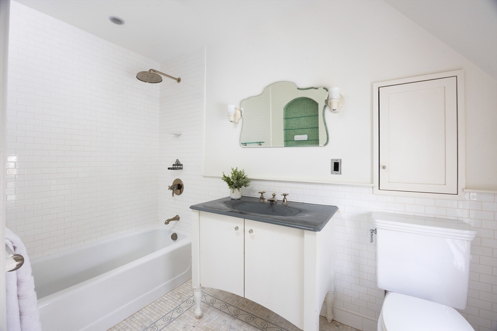 15 Hubbard Park Road Cambridge, MA 02138 - Photo 17 of 31 a bathroom with a sink a toilet and bathtub