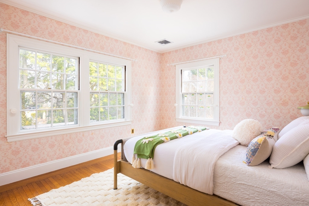 15 Hubbard Park Road Cambridge, MA 02138 - Photo 18 of 31 a bedroom with a bed and wooden floor