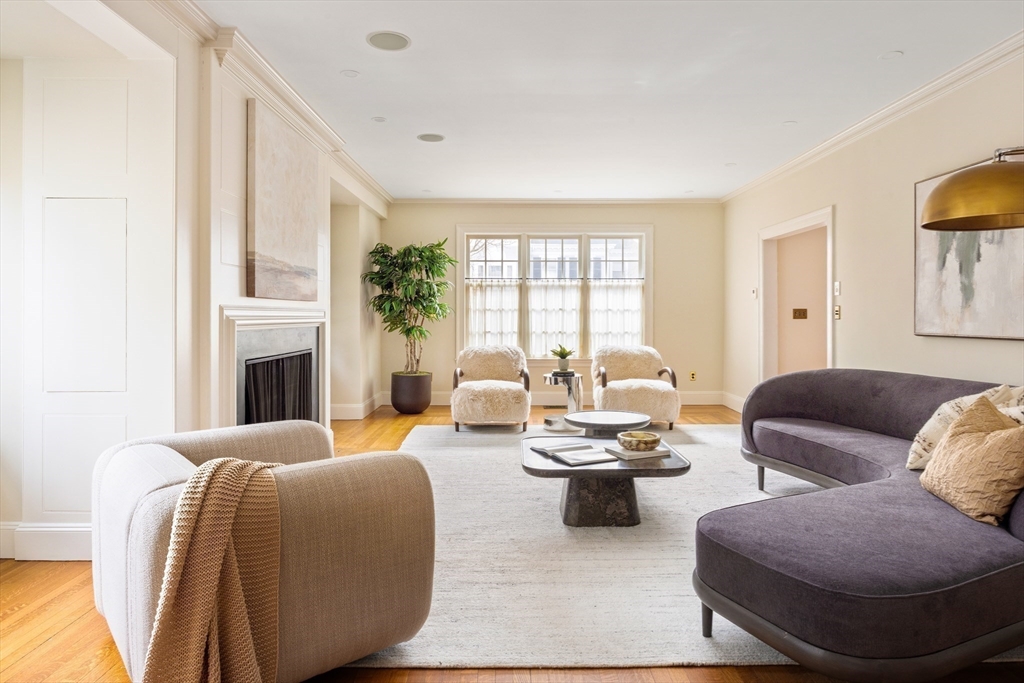 15 Hubbard Park Road Cambridge, MA 02138 - Photo 3 of 31 a living room with furniture and a fireplace