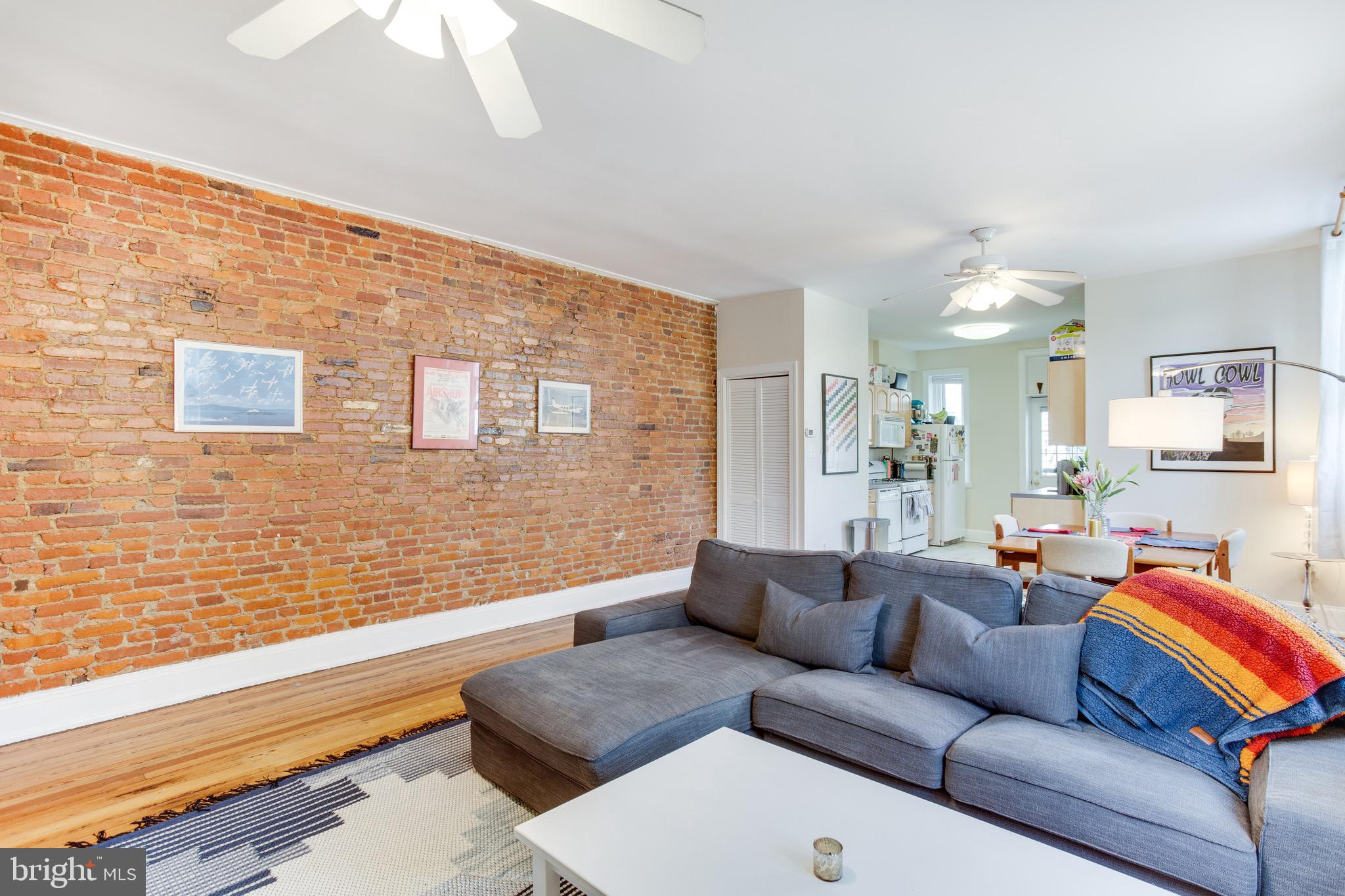 1948 3rd Street Northwest Washington, DC 20001 - Photo 12 of 32 Unit #1 Exposed Brick in Living Room