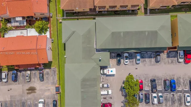 an aerial view of a residential houses with outdoor space
