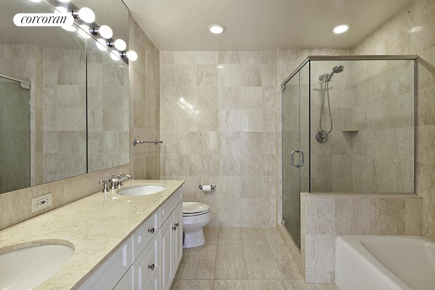 2 Columbus Avenue, Unit 31C Manhattan, NY 10023 - Photo 7 of 11 a bathroom with a double vanity sink mirror and shower