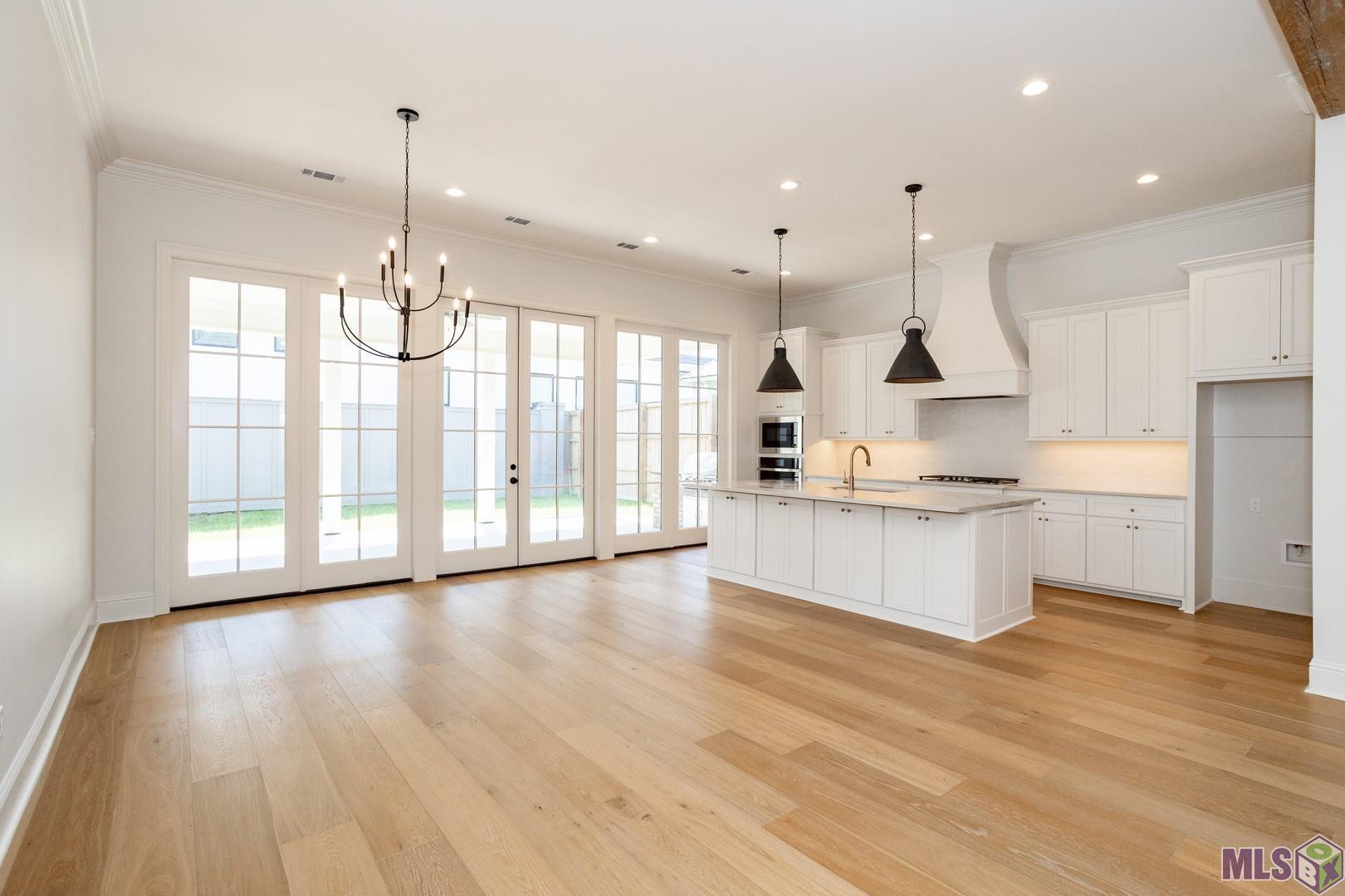 2127 Stableford Lane Baton Rouge, LA 70809 - Photo 15 of 46 Kitchen/Dining Room with Wall of Windows Allowing For Great Natural Light