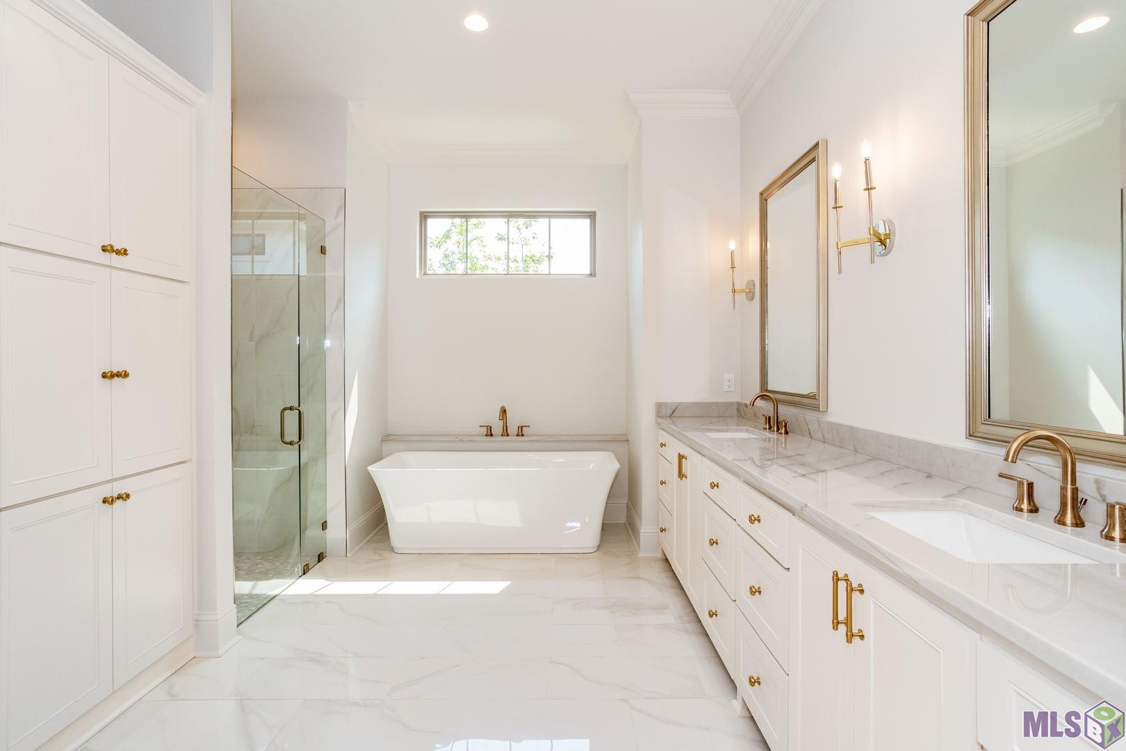 2127 Stableford Lane Baton Rouge, LA 70809 - Photo 27 of 46 Spa-like Primary Bathroom with Great Storage a Walk In Shower and Large Soaking Tub