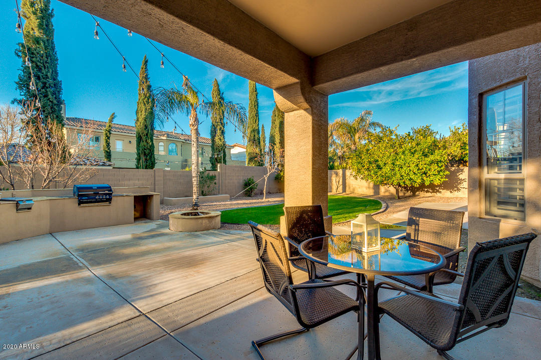 4640 East Reins Road Gilbert, AZ 85297 - Photo 73 of 122 a building outdoor space with patio furniture and potted plants