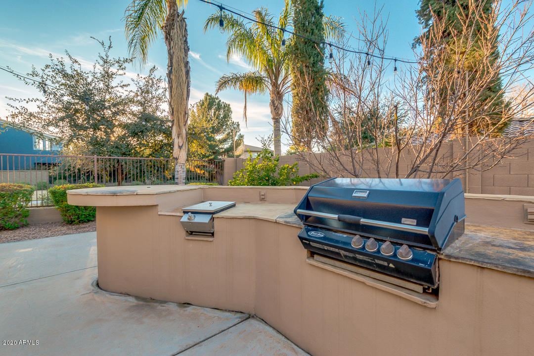 4640 East Reins Road Gilbert, AZ 85297 - Photo 76 of 122 a view of a patio with couches and a fire pit