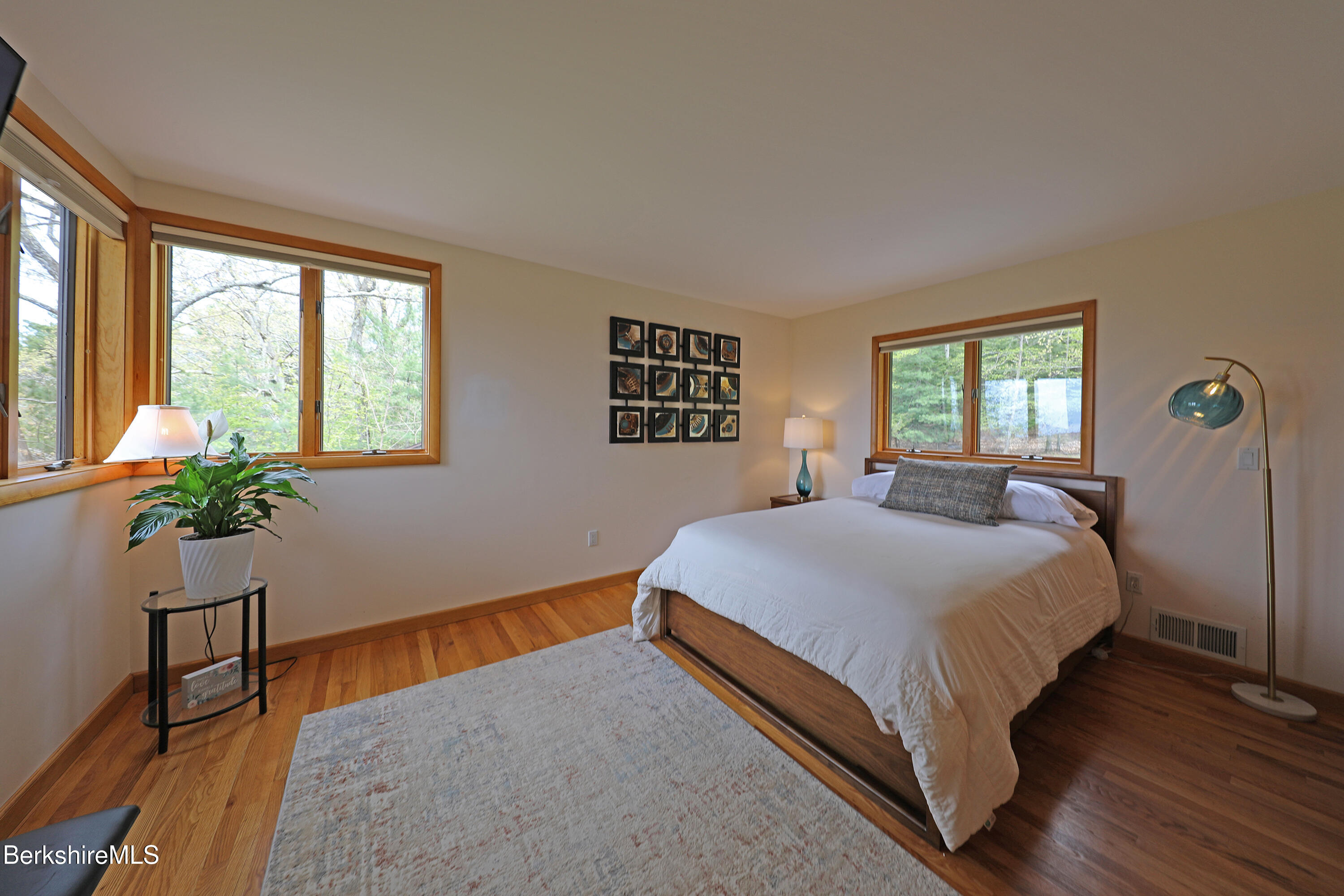 126 Temple Road New Lebanon, NY 12125 - Photo 13 of 37 a bedroom with a bed and a potted plant