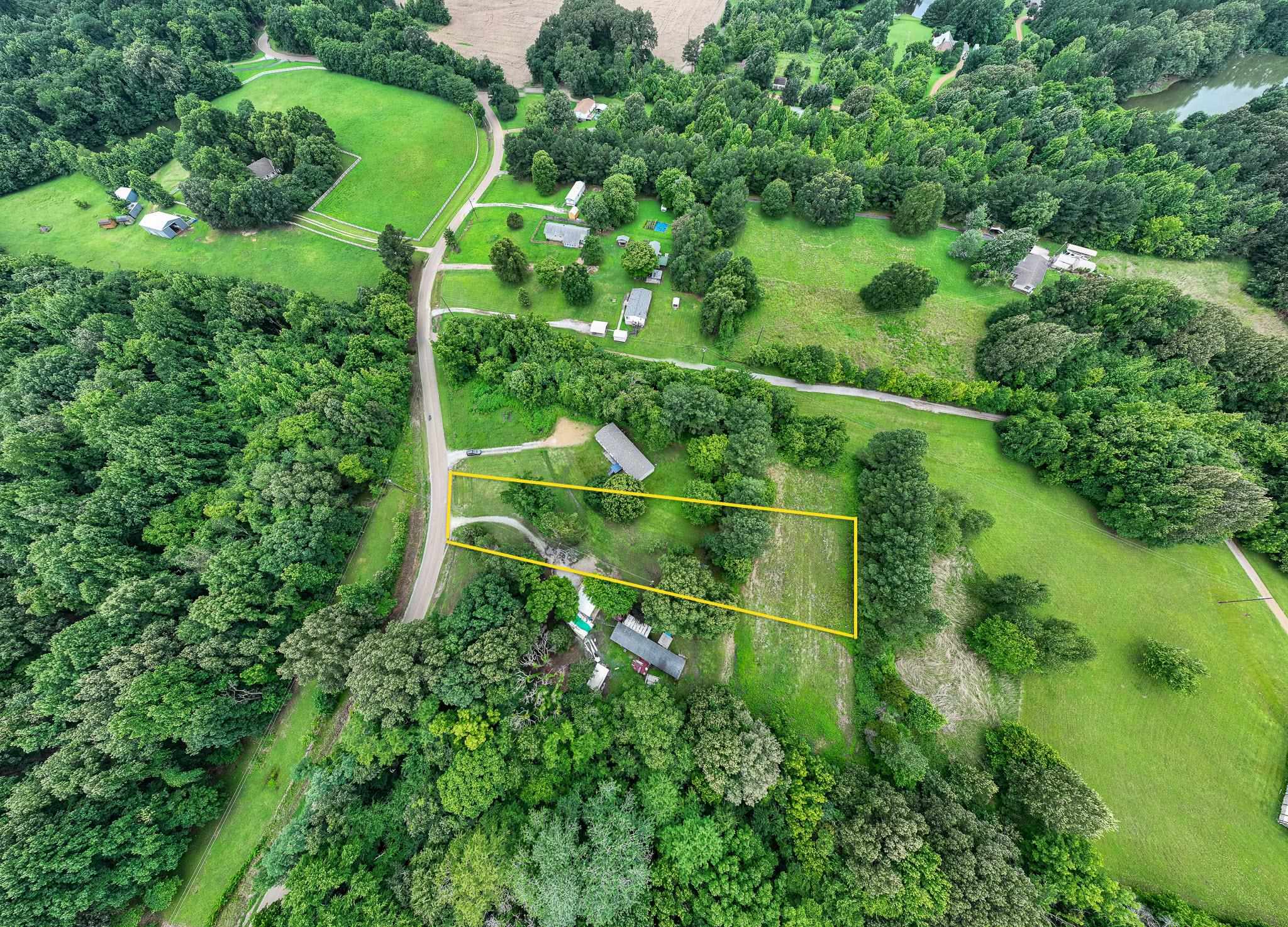 Aerial view of property's location featuring property parcel outlined