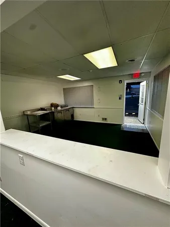 a bathroom with a sink and a large mirror