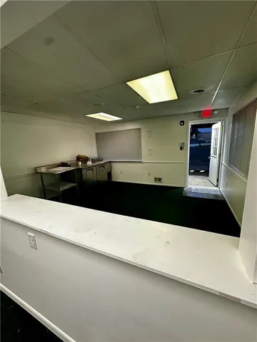 a bathroom with a sink and a large mirror